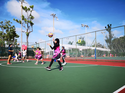 Netball players training intensively at a school holiday clinic in Singapore