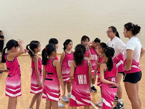 Young netball player looking anxious on match day compared to relaxed training